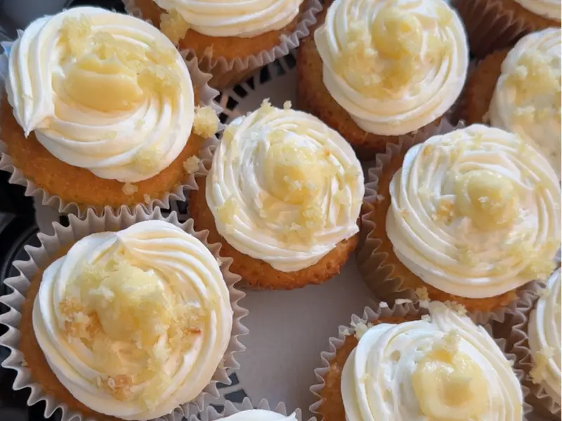 Cupcakes with white icing topped with crumble by Diner's Choice Eats