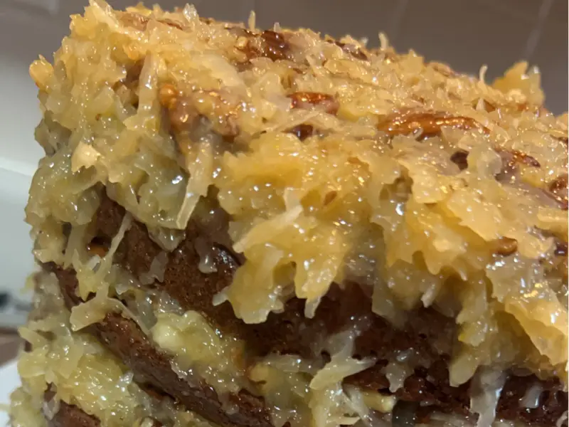 Layered coconut cake with almonds by Diner's Choice Eats