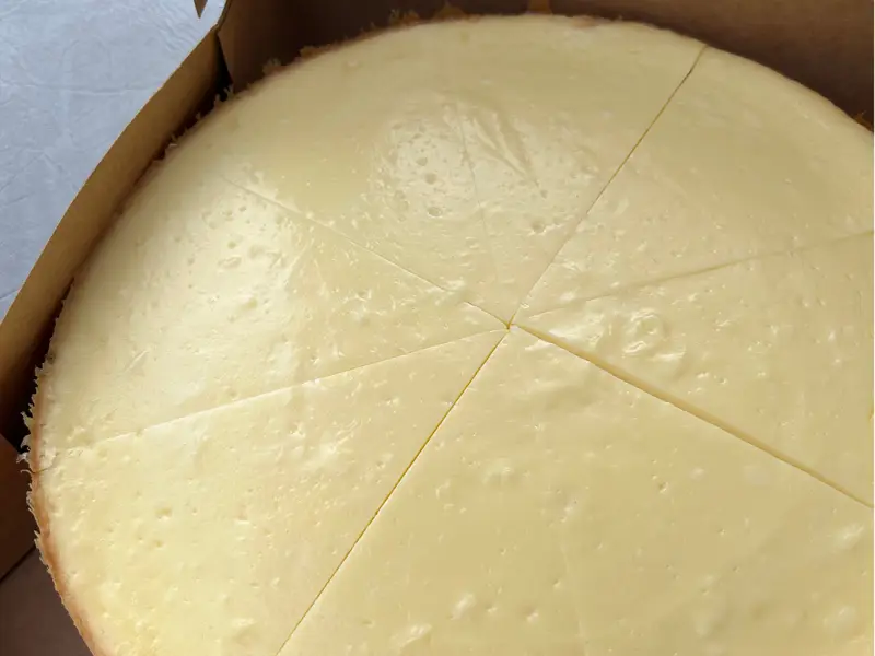 Classic cheesecake sliced and served in box by Diner's Choice Eats