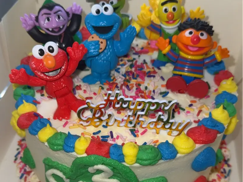 Sesame Street themed birthday cake with characters by Diner's Choice Eats