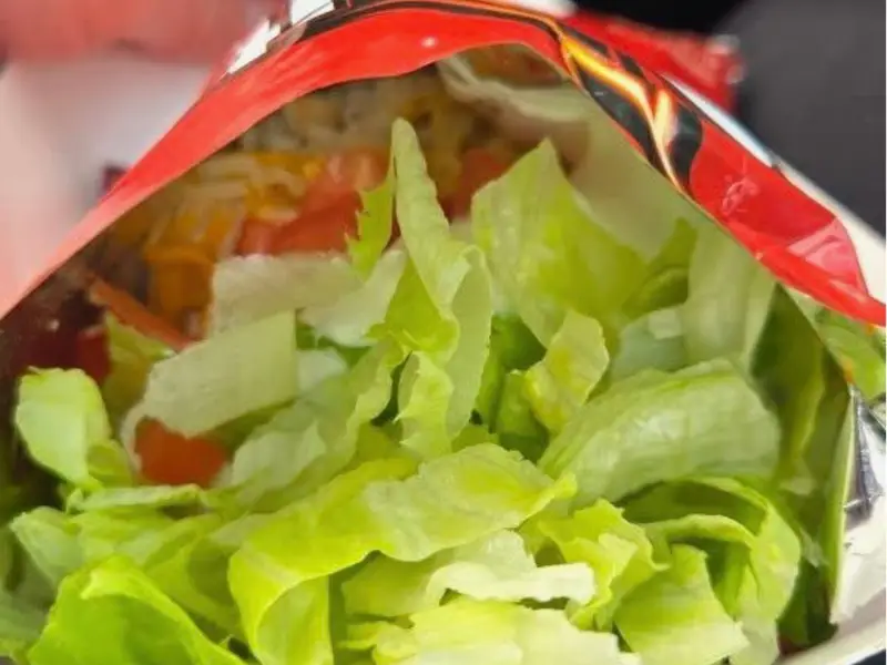 Walking Doritos taco with lettuce from Diner's Choice Eats food truck